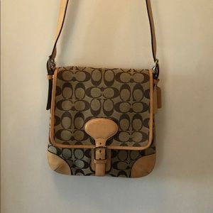 Coach signature leather and canvas crossbody bag.